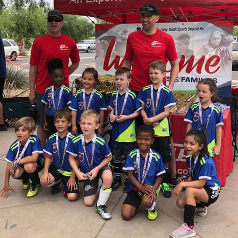 Phoenix Youth Sports League Championship team celebrates