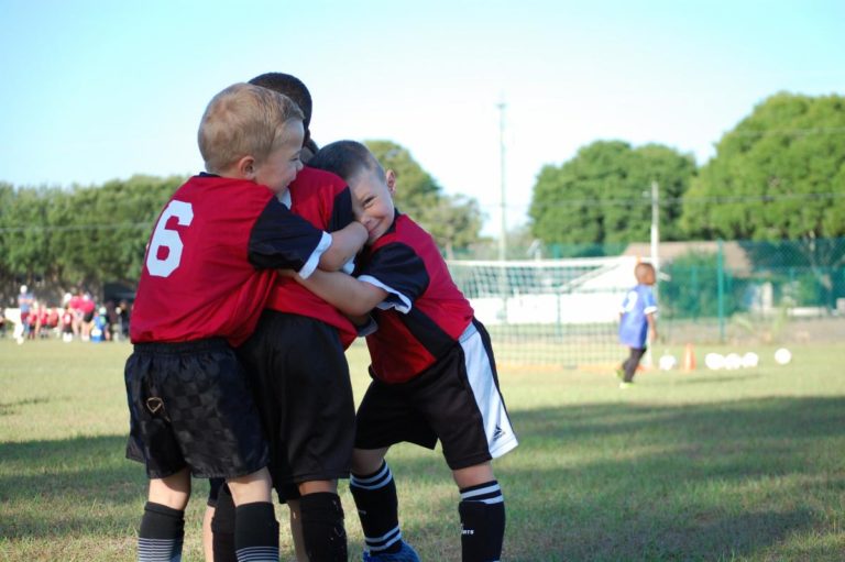 i9 sports kids hugging