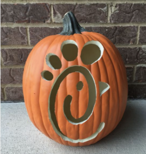 pumpkin with chick fil a logo carved into it.